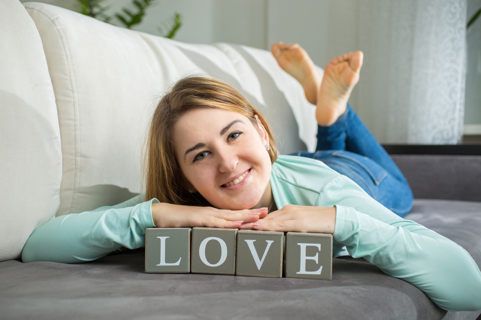 cute woman posing with decorative word "Love&quot
