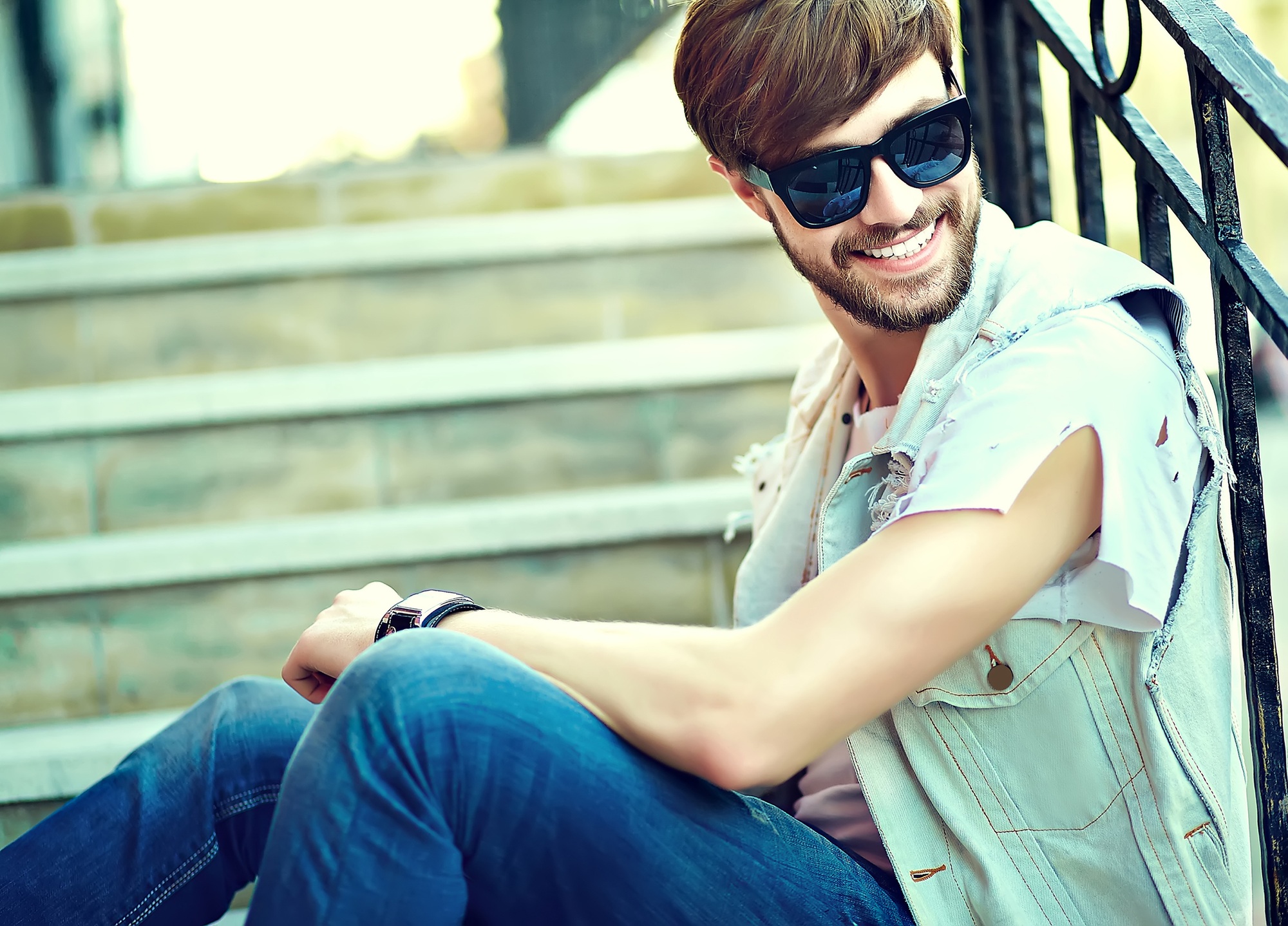 Portrait of handsome man posing in the street