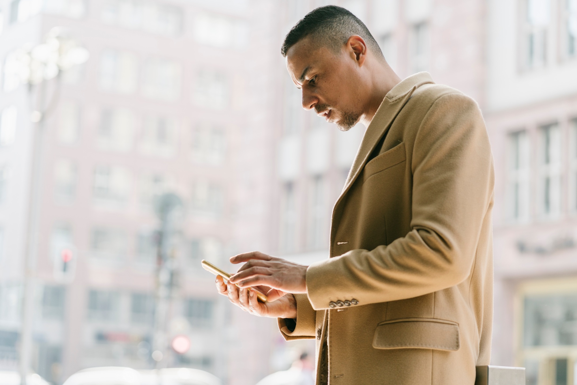 Portrait of businessman looking at smartphone