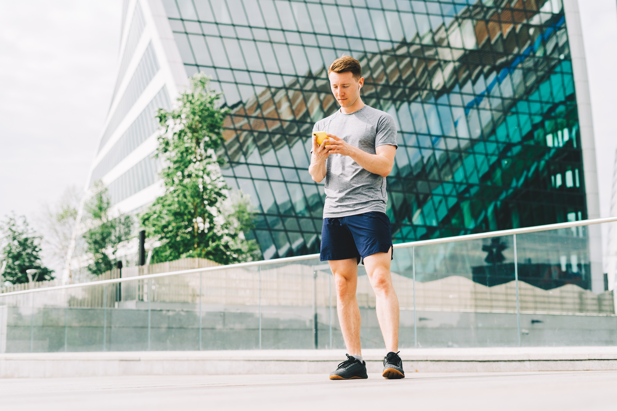 Athlete texting at cellphone, online ,messaging