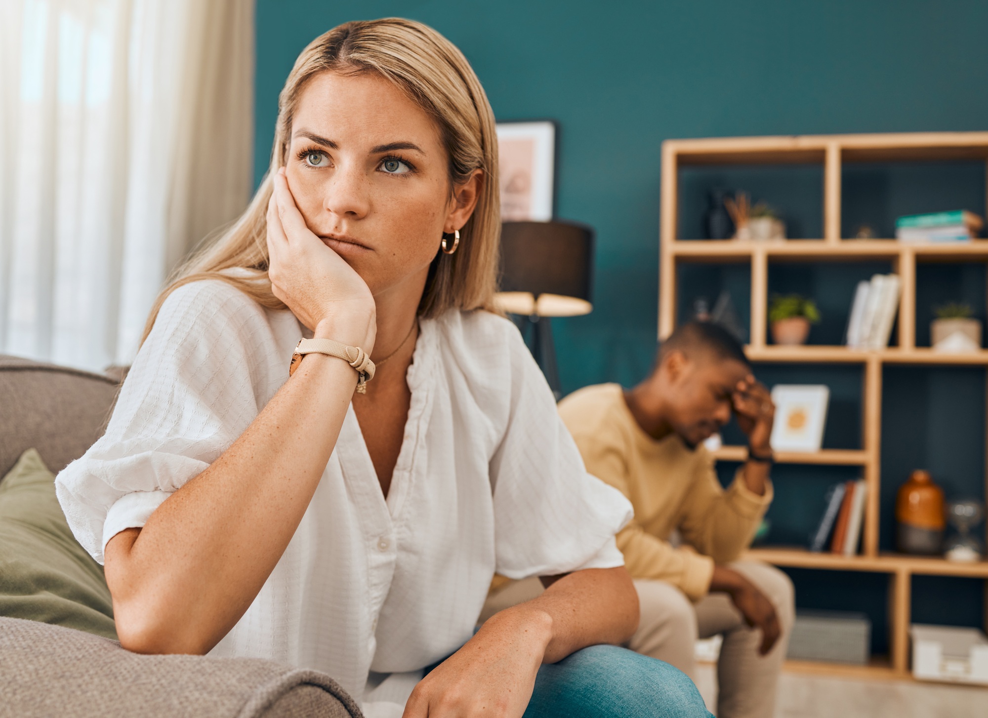 Divorce, affair and interracial couple angry in lounge, upset or disagreement with affair, separati